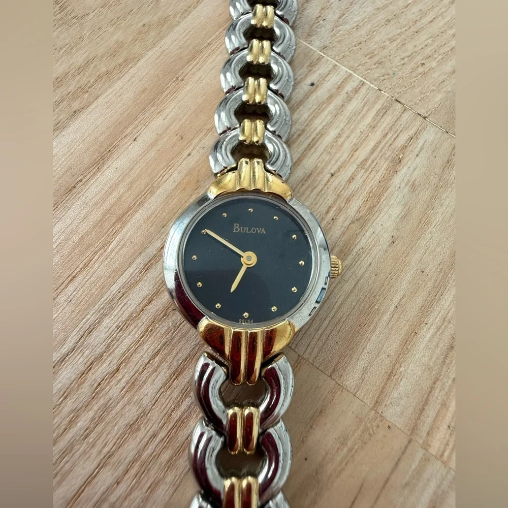 Bulova ladies black dial two toned dress watch NEW BATTERY